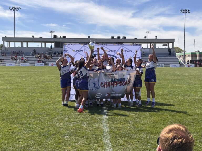 UCSB women's rugby team holding a trophy